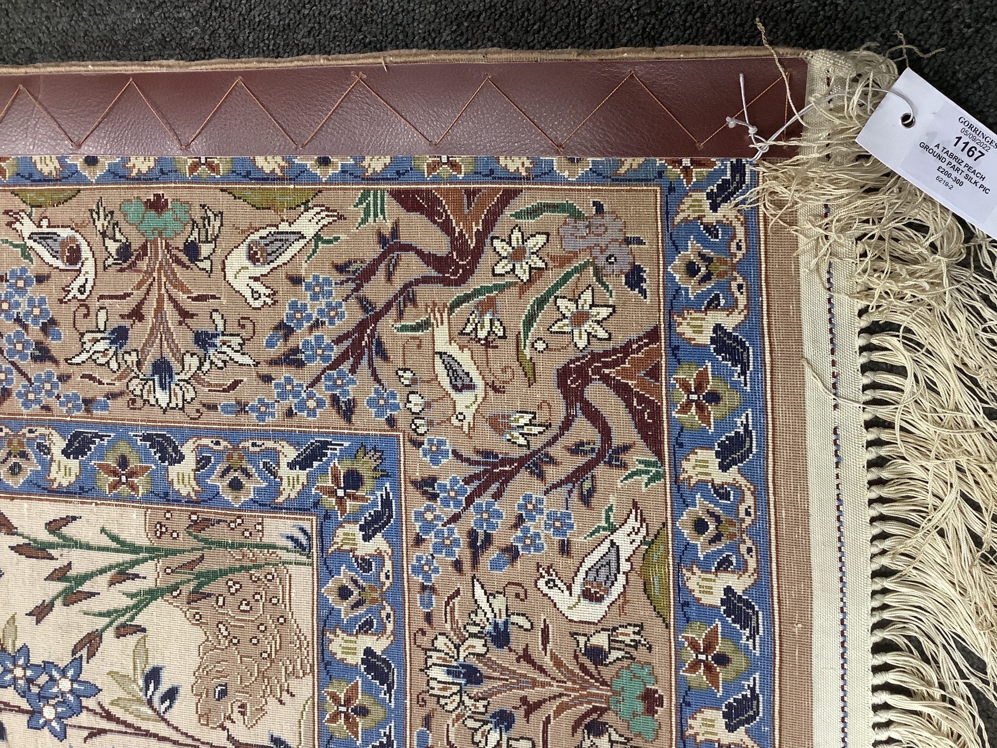 A Tabriz peach ground part silk pictorial rug, 180 x 111cm